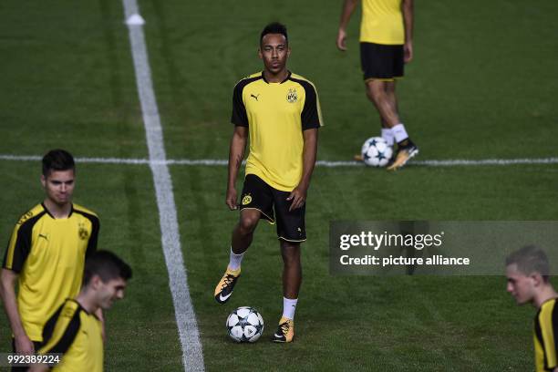 Borussia Dortmund's Pierre-Emerick Aubameyang takes part in a training session ahead of the UEFA Champions League Group H football match between...