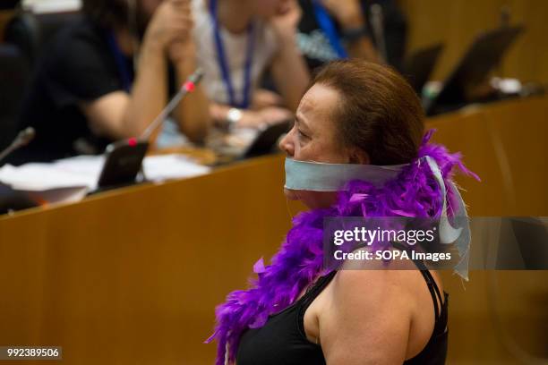 Woman is seen covering her mouth with a handkerchief. The Congress hosted a parliamentary session on the possible reform of the Gag Law with the...