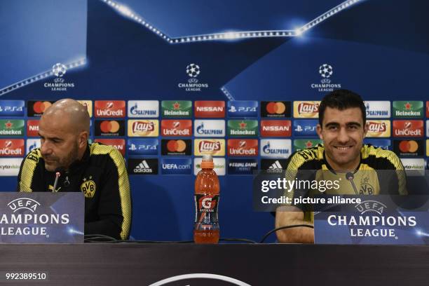 Borussia Dortmund's Head coach Peter Bosz and Sokratis Papastathopoulos during a press conference ahead of the UEFA Champions League Group H football...