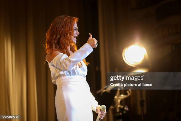 Singer Andrea Berg performs on stage during her first concert of her 'Hautnah' tour in the Laeiszhalle in Hamburg, Germany, 16 October 2017. With her...