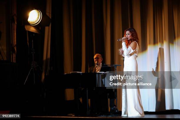 Singer Andrea Berg performs on stage during her first concert of her 'Hautnah' tour in the Laeiszhalle in Hamburg, Germany, 16 October 2017. With her...