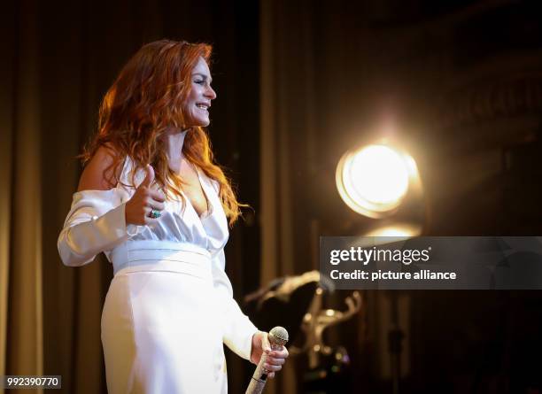 Singer Andrea Berg can be seen during the first concert of her tour "Hautnah" at the Laezishalle in Hamburg, Germany, 16 October 2017. With her...