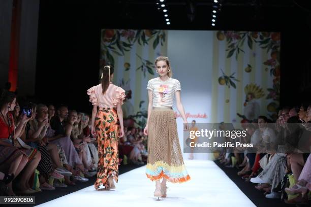 The photo shows models with the Lena Hoschek collection on the catwalk.