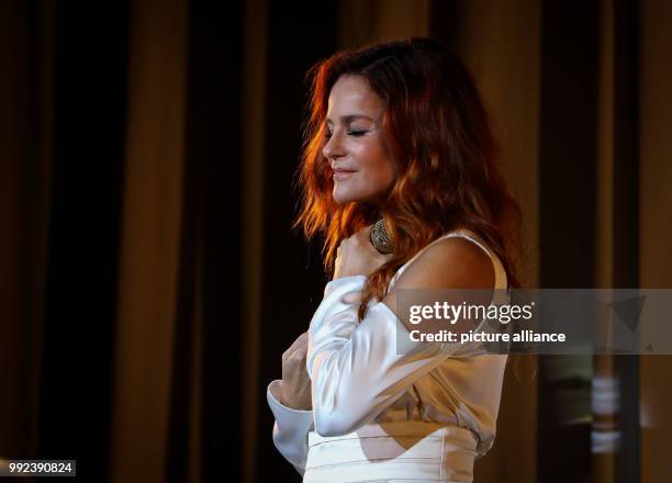 Singer Andrea Berg can be seen during the first concert of her tour "Hautnah" at the Laezishalle in Hamburg, Germany, 16 October 2017. With her...