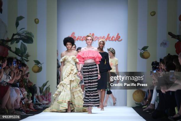 The photo shows models with the Lena Hoschek collection on the catwalk.