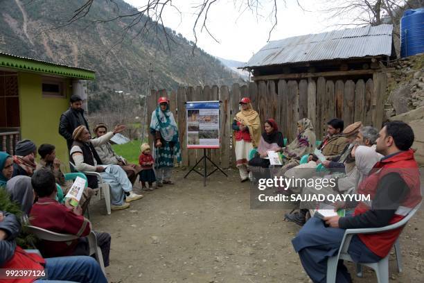 This picture taken on February 27, 2018 shows Pakistani Kashmiri Salima Bibi a victim of a landmine blast, giving an awareness campaign for landmines...