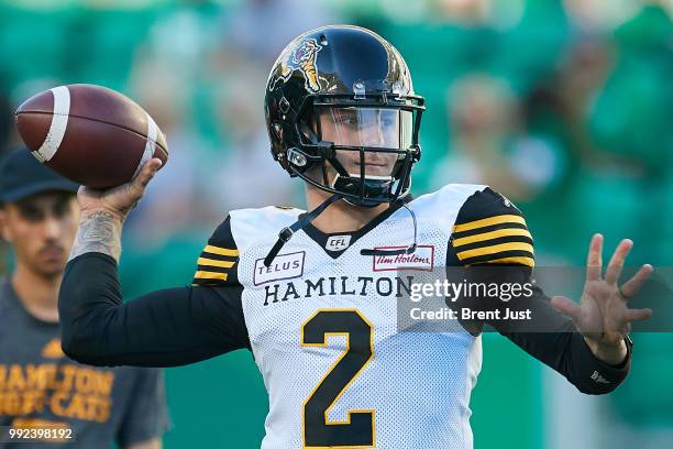 Johnny Manziel of the Hamilton Tiger-Cats throws a pass in pregame warmup before the game between the Hamilton Tiger-Cats and Saskatchewan...