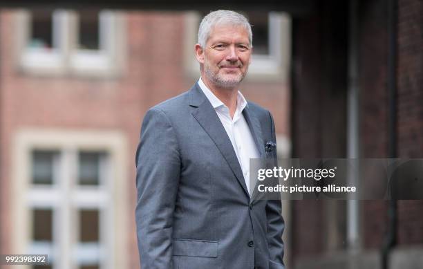Wolfgang Krogmann, the head of the German arm of the clothes discounter Primark, holds a Primark bag in Münster, Germany, 17 October 2017. The chain...