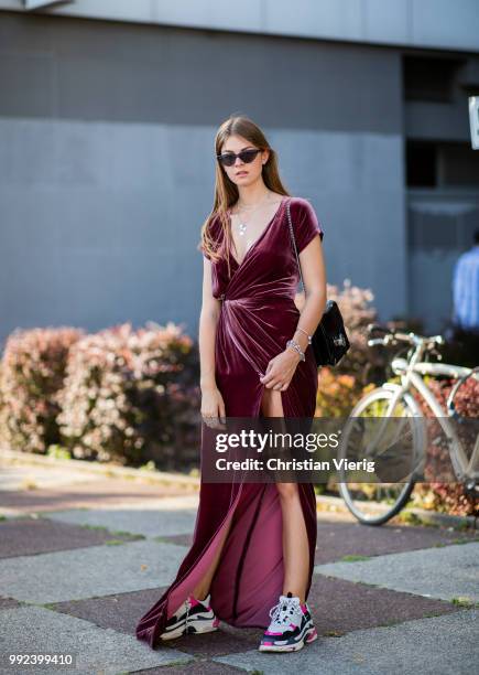 Jacqueline Zelwis wearing velvet dress, Balenciaga sneakers seen outside Dawid Tomaszewski during the Berlin Fashion Week July 2018 on July 5, 2018...