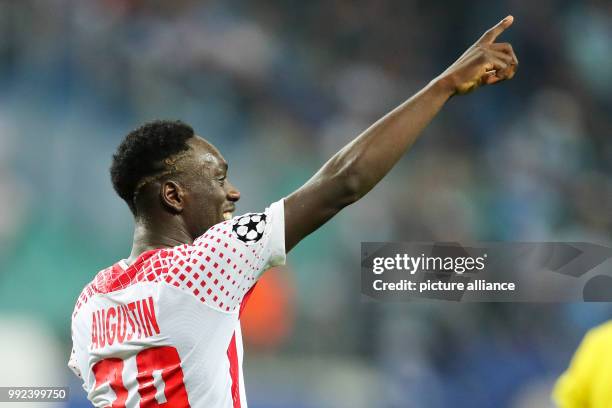 Leipzig's Jean-Kevin Augustin celebrates after giving his side a 3:1 lead during the Champions League group stages qualification match between RB...