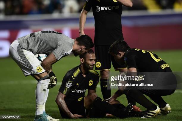 Dortmund's Oemer Toprak in pain after being injured during the Champions League group stages qualification match between APOEL Nicosia and Borussia...