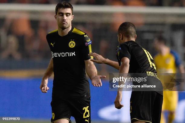 Dortmund's Sokratis Papastathopoulos celebrates the 1-1 goal with Jeremy Toljan during the Champions League group stages qualification match between...