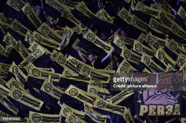 Dpatop - Borussia Dortmund fans hold their scarves during the UEFA Champions League Group H football match between APOEL Nicosia and Borussia...