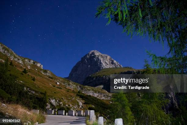 mt. mangart in blue moon light - blue moon imagens e fotografias de stock