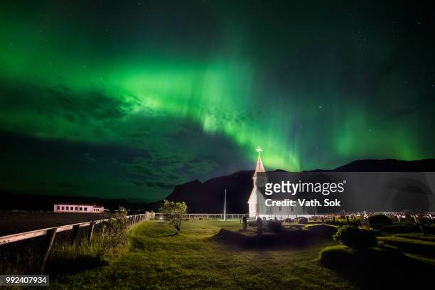aurora over reyniskirkja a church in iceland. - sok stock pictures, royalty-free photos & images