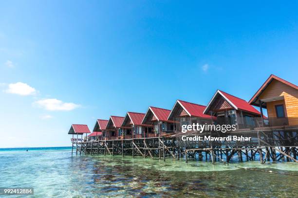 water bungalows at mabul island in borneo, malaysia - mabul island fotografías e imágenes de stock