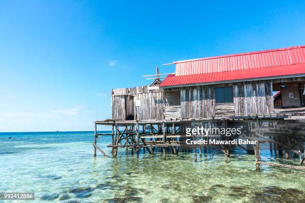 water bungalows under renovation at mabul island in borneo, malaysia - mabul island stock pictures, royalty-free photos & images
