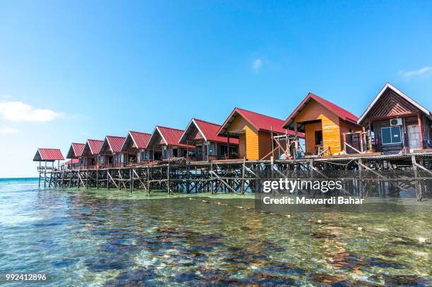 water bungalows at mabul island in borneo, malaysia - mabul island stock pictures, royalty-free photos & images