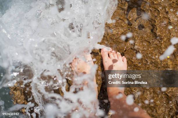 barefoot on the cliff - barefoot snow stock pictures, royalty-free photos & images