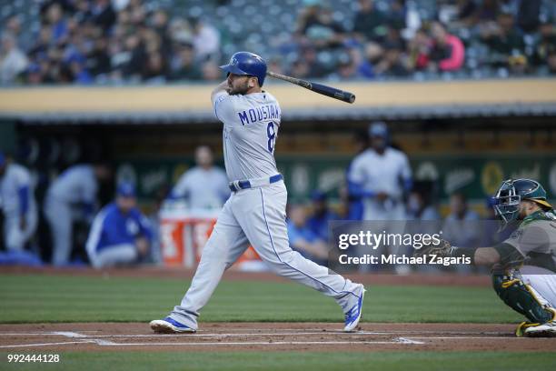 Mike Moustakas of the Kansas City Royals bats during the game against the Oakland Athletics at the Oakland Alameda Coliseum on June 7, 2018 in...