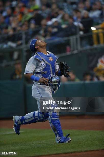 Salvador Perez of the Kansas City Royals chases a foul ball during the game against the Oakland Athletics at the Oakland Alameda Coliseum on June 7,...