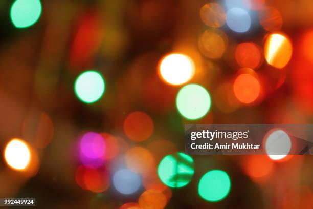 bokeh (out of focus) christmas lights. - lights out stock pictures, royalty-free photos & images