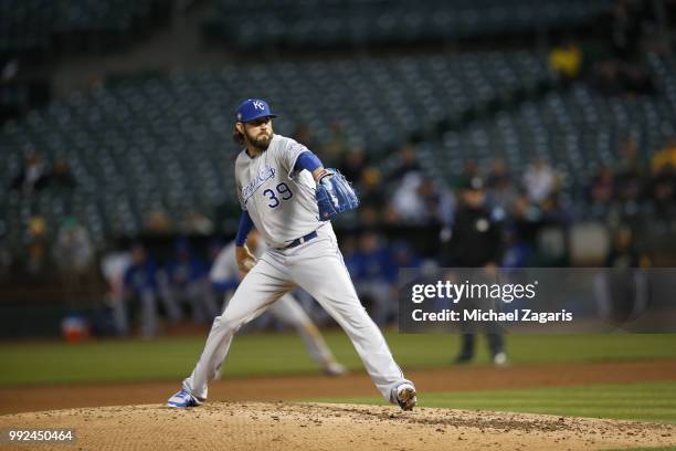 Jason Hammel of the Kansas City Royals pitches during the game against the Oakland Athletics at the Oakland Alameda Coliseum on June 7, 2018 in...