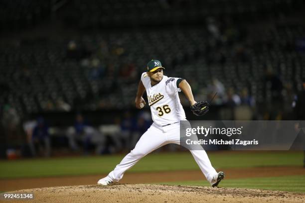 Yusmeiro Petit of the Oakland Athletics pitches during the game against the Kansas City Royals at the Oakland Alameda Coliseum on June 7, 2018 in...