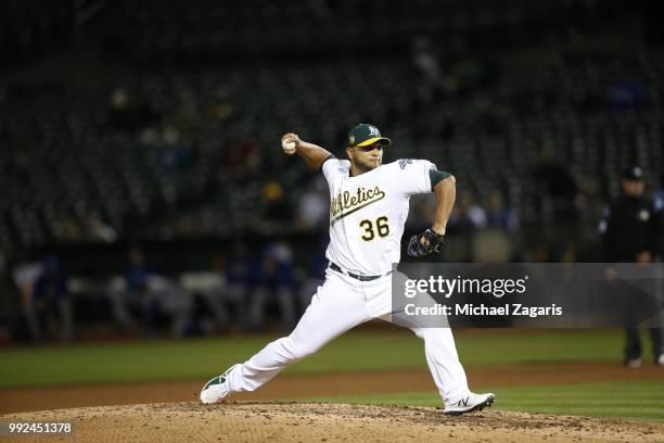 Yusmeiro Petit of the Oakland Athletics pitches during the game against the Kansas City Royals at the Oakland Alameda Coliseum on June 7, 2018 in...