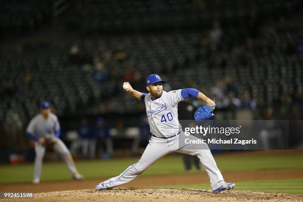 Kelvin Herrera of the Kansas City Royals pitches during the game against the Oakland Athletics at the Oakland Alameda Coliseum on June 7, 2018 in...