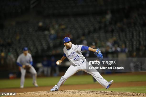 Kelvin Herrera of the Kansas City Royals pitches during the game against the Oakland Athletics at the Oakland Alameda Coliseum on June 7, 2018 in...