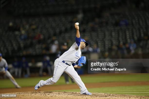 Kelvin Herrera of the Kansas City Royals pitches during the game against the Oakland Athletics at the Oakland Alameda Coliseum on June 7, 2018 in...
