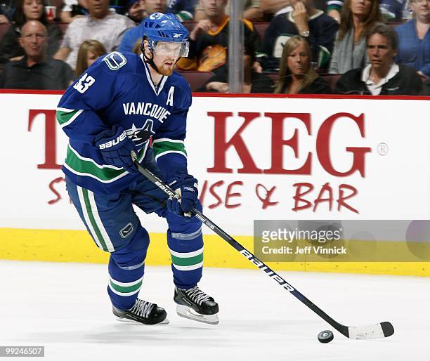 Henrik Sedin of the Vancouver Canucks skates up ice with the puck in Game 6 of the Western Conference Semifinals against the Chicago Blackhawks...