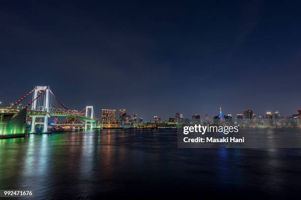 tokyo tower and rainbowbridge at night - masaki stock pictures, royalty-free photos & images