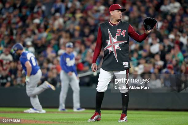 Felix Hernandez reacts after giving a three run home run to Mike Moustakas in the first inning during their game at Safeco Field on June 30, 2018 in...