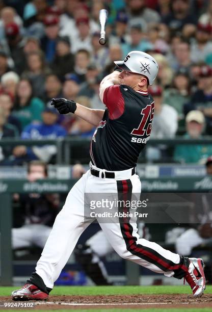 Kyle Seager loses his bat while batting in the first inning against the Kansas City Royals during their game at Safeco Field on June 30, 2018 in...
