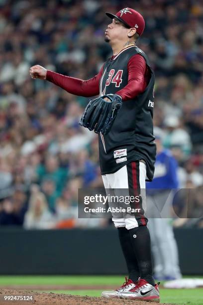 Felix Hernandez of the Seattle Mariners reacts in the fifth inning against the Kansas City Royals during their game at Safeco Field on June 30, 2018...