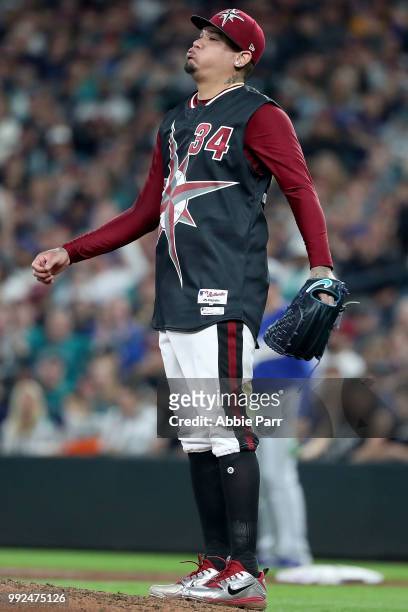 Felix Hernandez of the Seattle Mariners reacts in the fifth inning against the Kansas City Royals during their game at Safeco Field on June 30, 2018...