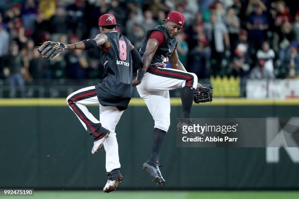 Denard Span and Dee Gordon of the Seattle Mariners celebrate their 6-4 win against the Kansas City Royals during their game at Safeco Field on June...
