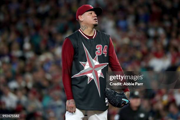 Felix Hernandez reacts after giving up a three run home run to Mike Moustakas in the first inning during their game at Safeco Field on June 30, 2018...