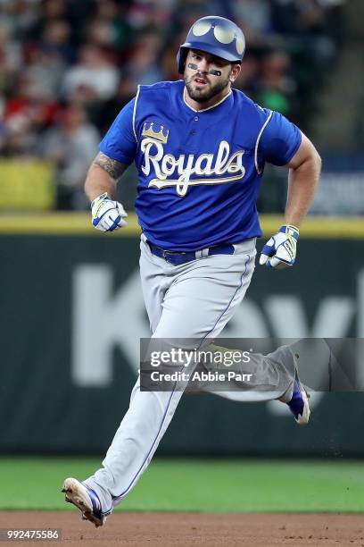 Mike Moustakas laps the bases after hitting a three run home run against the Seattle Mariners during their game at Safeco Field on June 30, 2018 in...