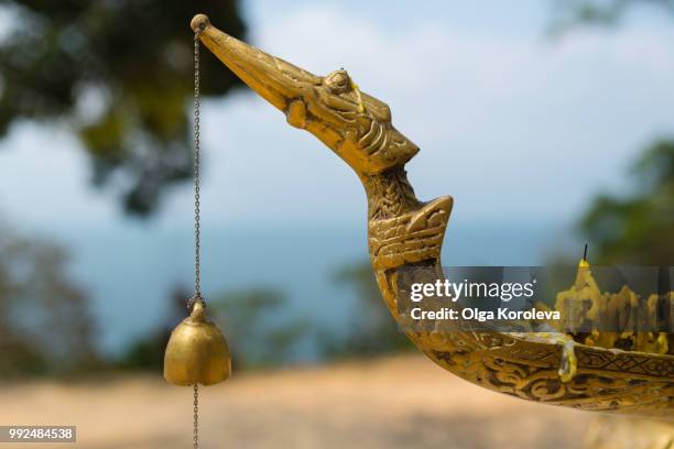 buddhist bell on the candlestick - candlestick stock pictures, royalty-free photos & images