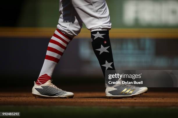 Detail view of the Independence Day themed socks and cleats worn by Keon Broxton of the Milwaukee Brewers during the game against the Minnesota Twins...