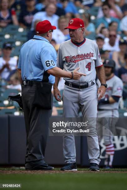 Manager Paul Molitor of the Minnesota Twins argues a call with umpire Marty Foster in the ninth inning against the Milwaukee Brewers at Miller Park...