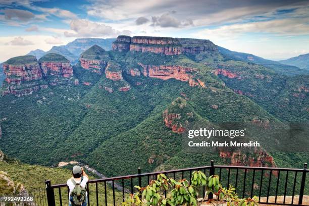 girl taking photo of three rondavels at blyde river canyon - blyde river canyon stock pictures, royalty-free photos & images