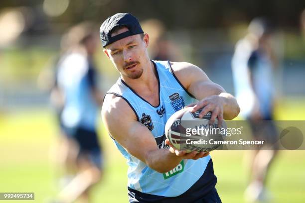 Damien Cook of the Blues passes during a New South Wales Blues State of Origin training session at Coogee Oval on July 6, 2018 in Sydney, Australia.