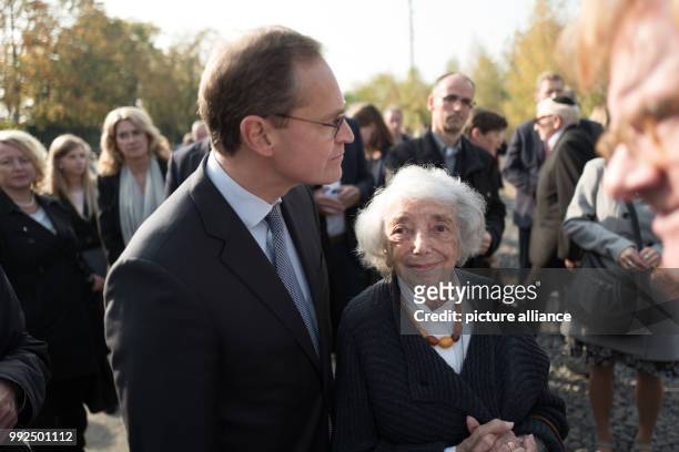 Berlin's mayor Michael Mueller from the Social Democratic Party of Germany and the Holocaust survivor Margot Friedlaender commemorate the begin of...