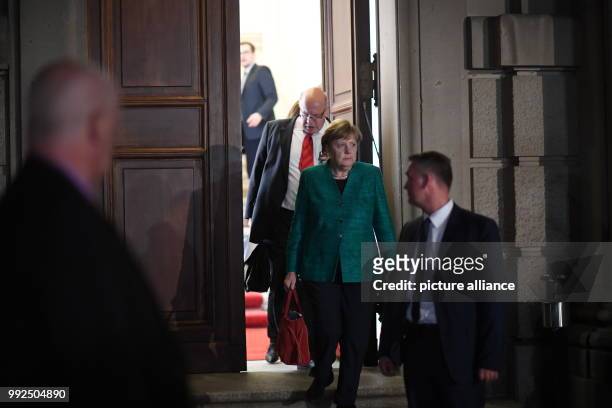 German chancellor Angela Merkel and the president of the state chancellery Peter Altemeier after conducting coalition talks regarding the formation...