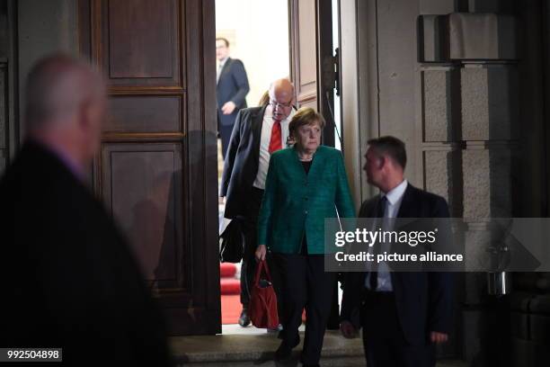 Dpatop - German chancellor Angela Merkel and the president of the state chancellery Peter Altemeier after conducting coalition talks regarding the...