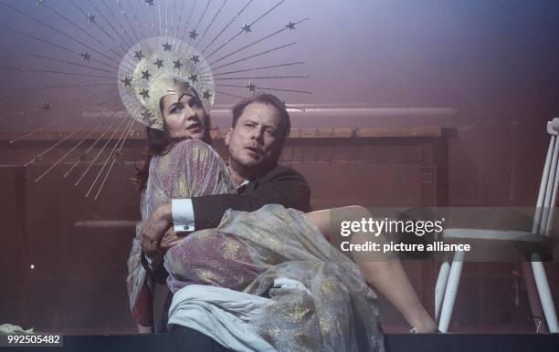 Actors Stephanie Eidt and Christian Kuchenbuch perform on stage during a rehearsal of the play 'The Kidnap of Europe' in Berlin, Germany, 18 October...